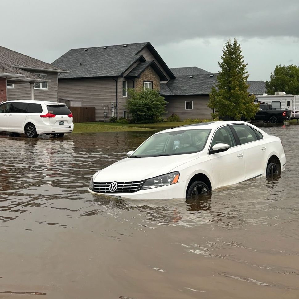 Flooded vehicle in Clearspring Greens, Steinbach