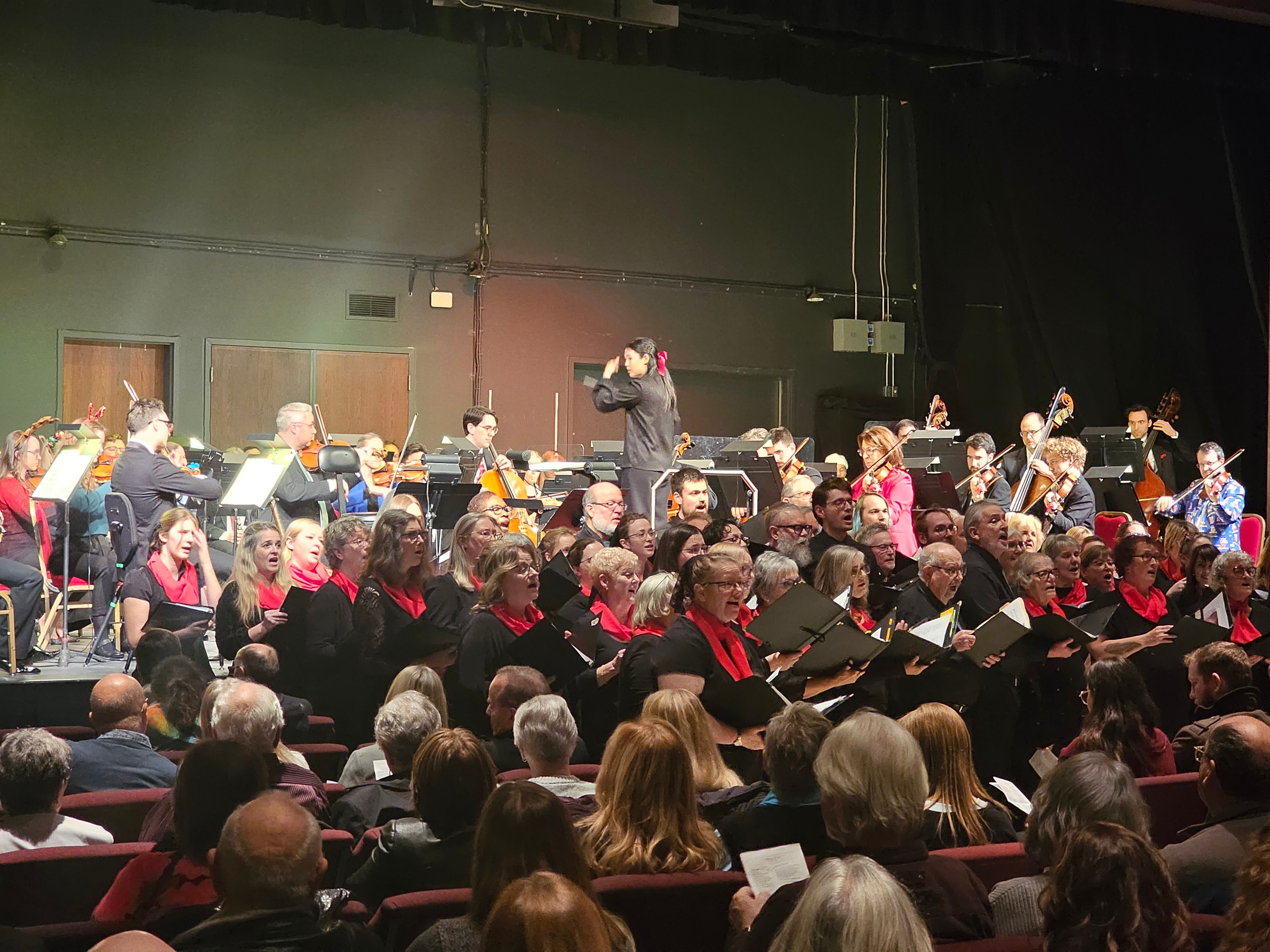 Monica Chen, at the conductor's stand, ensures that each section of the orchestra plays with the utmost precision and perfection, while the Prairie Vox Community Choir lend their voices to the mix. PORTAGEONLINE / TYLOR BAER