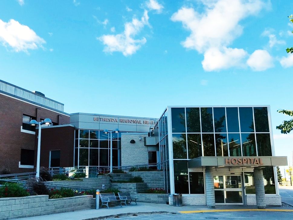 The exterior of a large building with lettering Bethesda Regional Health Centre.
