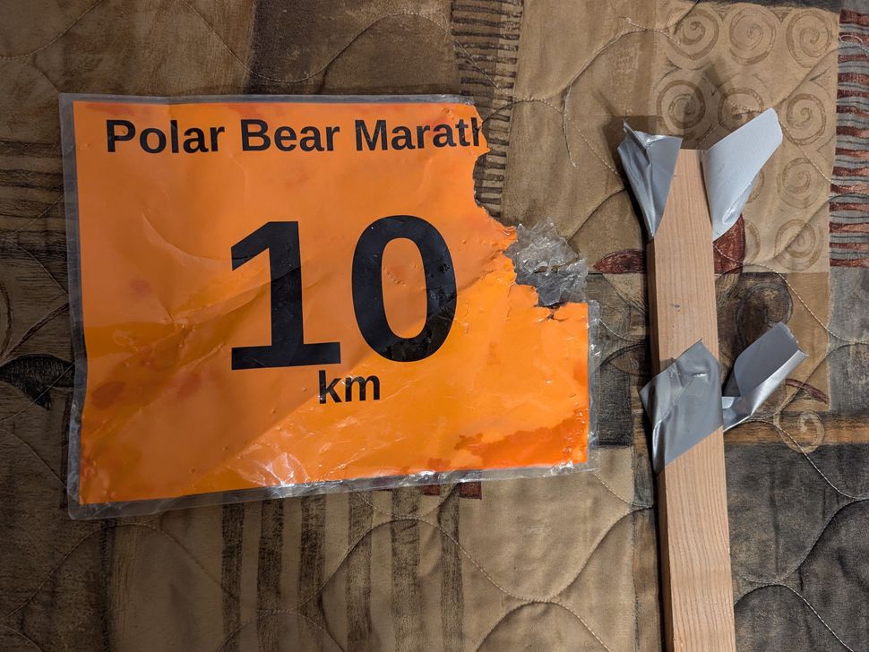 Marathon mile marker sign mangled by a polar bear. (submitted)