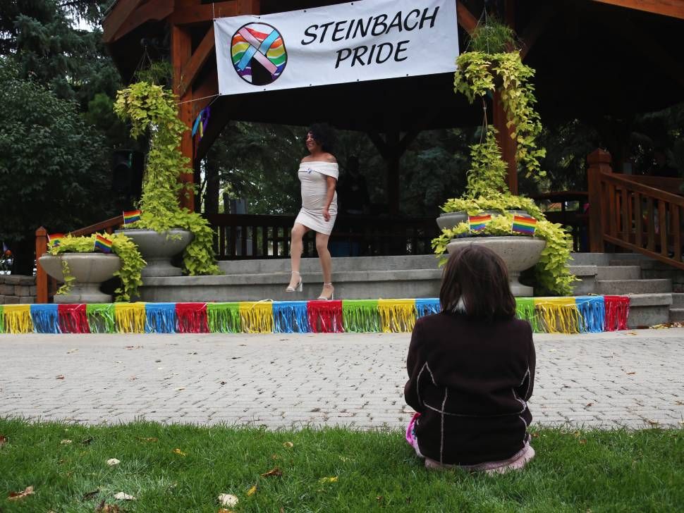 child watches drag performer