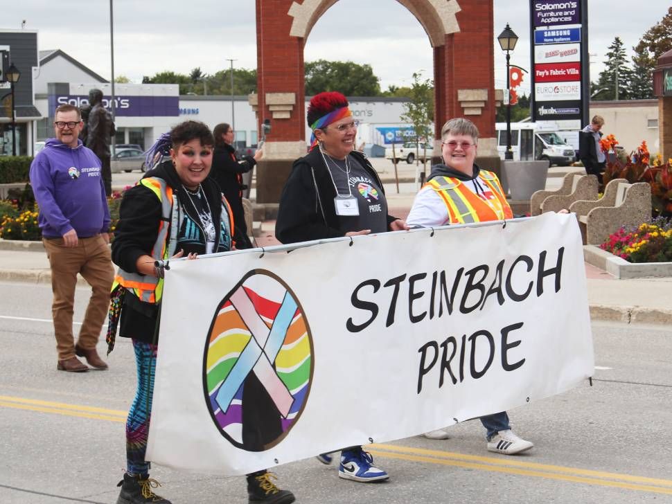 Steinbach Pride members with banner