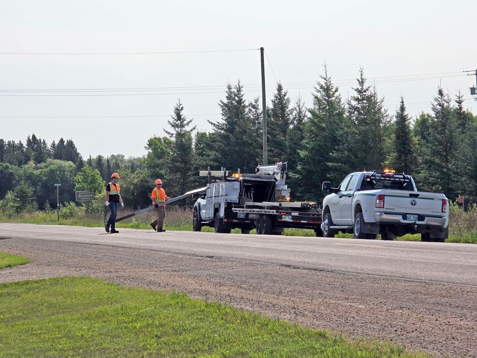 Manitoba Highways staff were seen moving speed limit signs on Tuesday, August 11, 2026. (photo by Jacquie Loeppky)