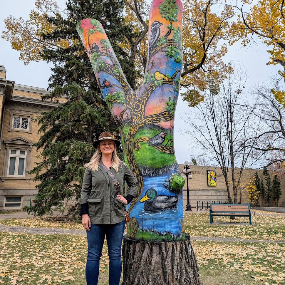 Carly Jaye and her artwork themed around the birds of Crescent Park (photo by Gordon Edgar)