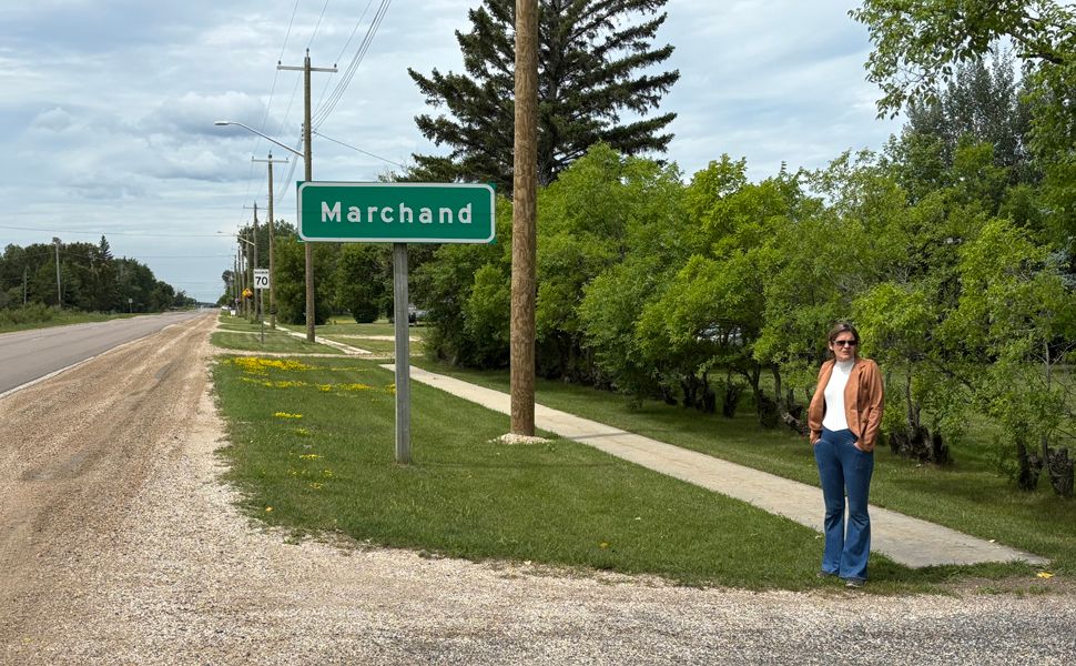 Jacquie Loeppky (July 2025) standing near her driveway with the 70km speed sign.