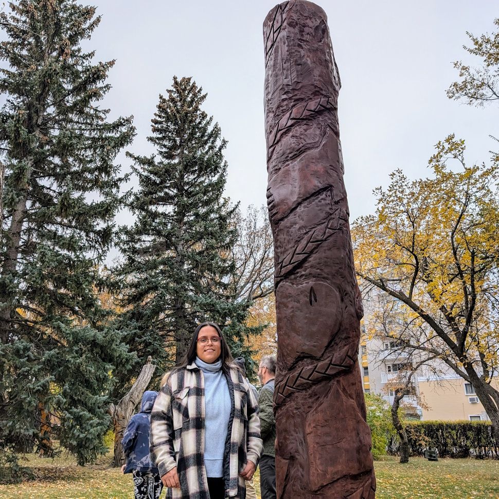 Sadi Rose Vaxvick and her artwork themed around Plains Cree's Seven Sacred Grandfather Teachings (photo by Gordon Edgar)