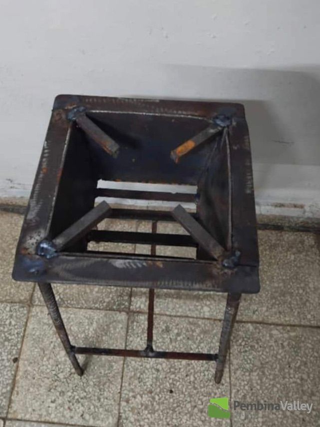 Charcoal cooker used to cook food as there is no power or gas.