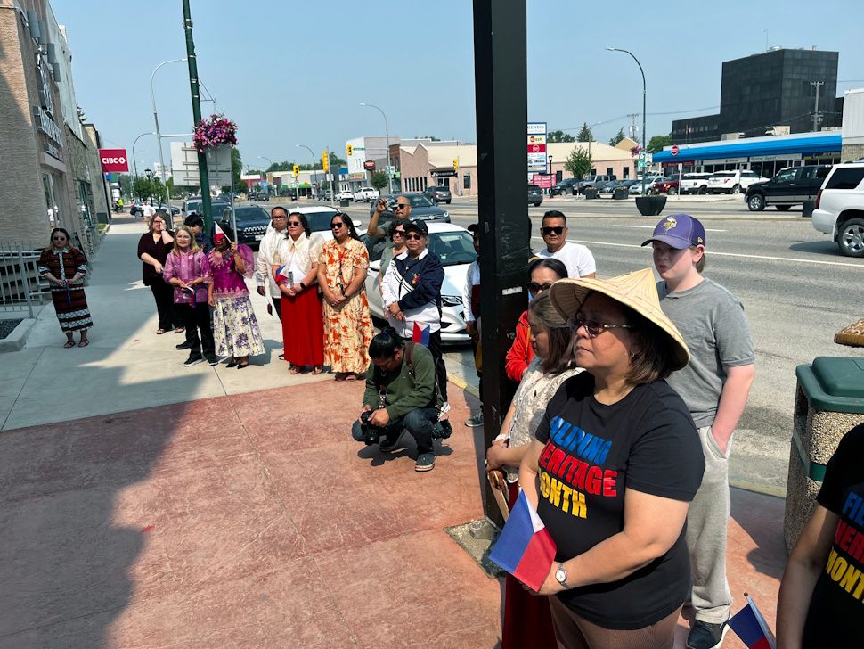 Members of the Filipino Association watching the Filipino Heritage Month flag-raising ceremony outside Portage la Prairie City Hall.