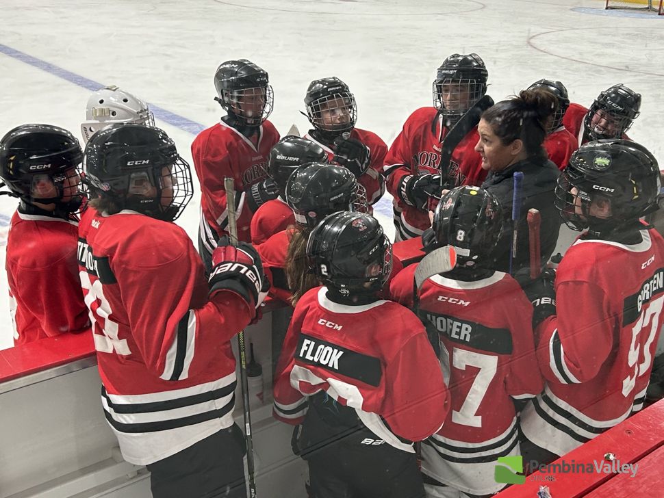Morgan Mullin giving instructions behind the bench