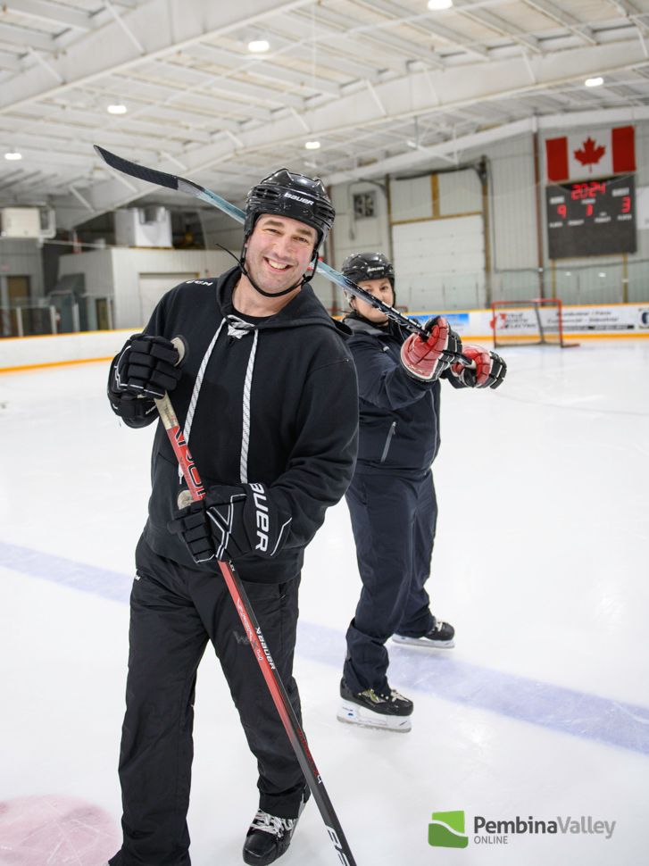 Mullin with her husband on the ice - the call would be high sticking...
