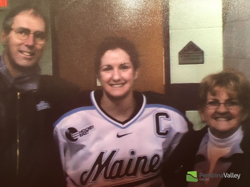 Mullin with her parents wearing a Maine jersey