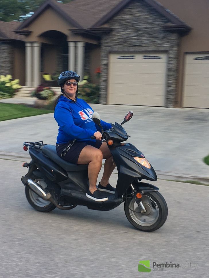 Mullin on a moped