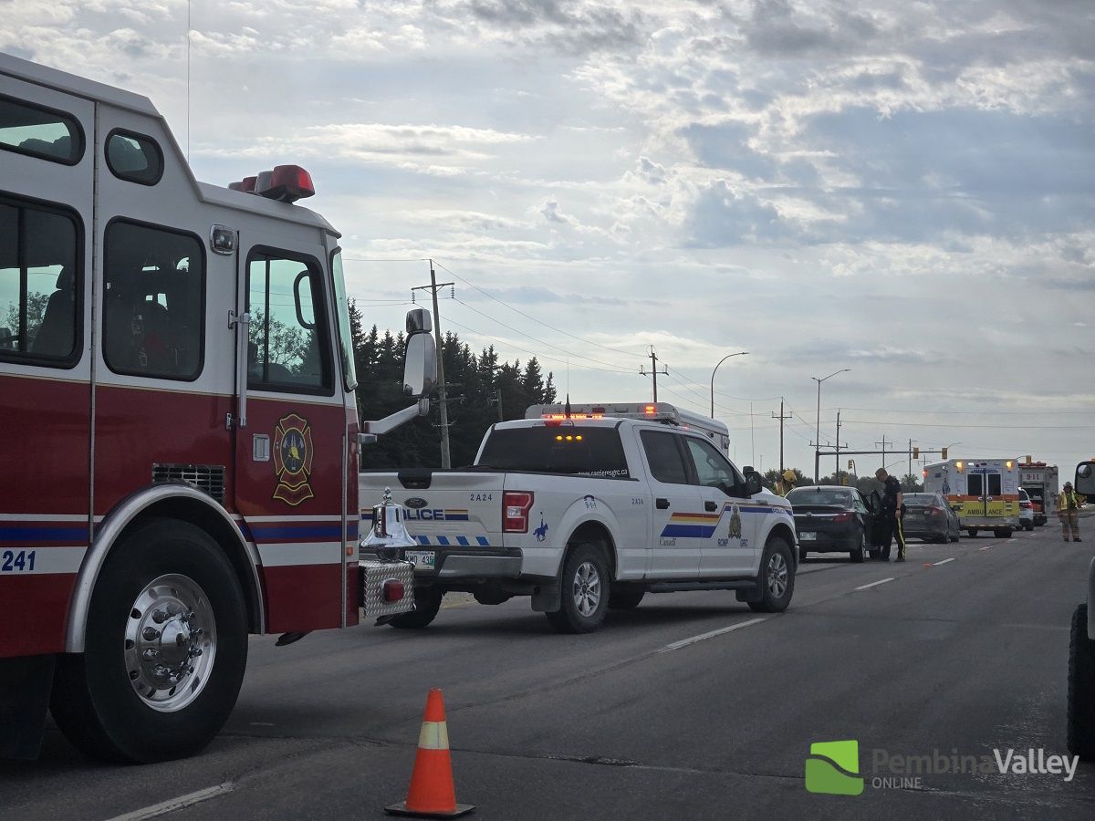 Emergency crews attend to a collision scene