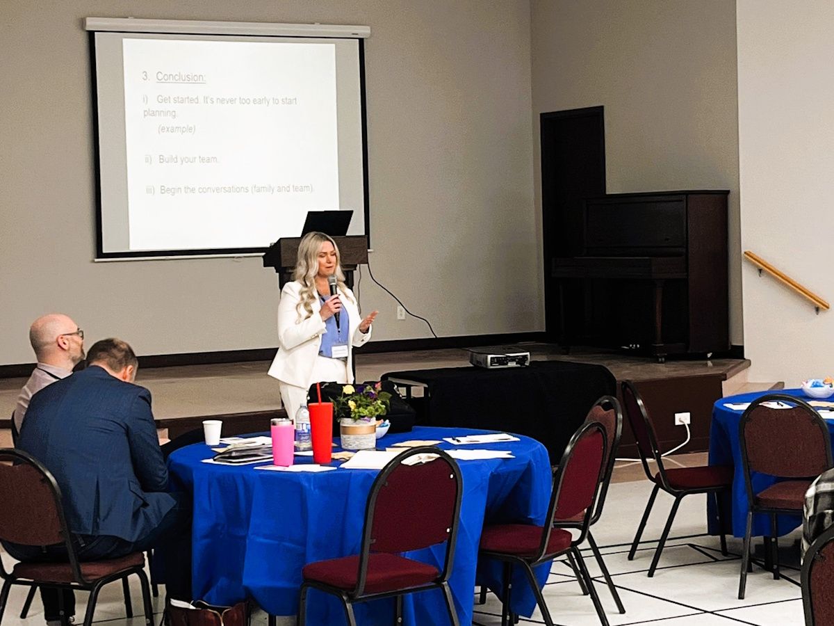 a financial advisor speaking to a room