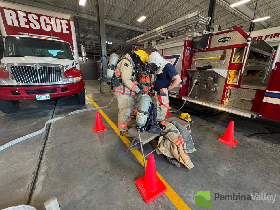 Fire fighters working on their gear
